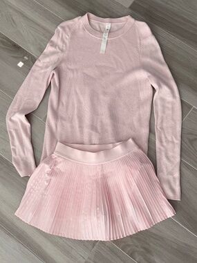 Pink Lululemon set skirt with shorts inside and sweater